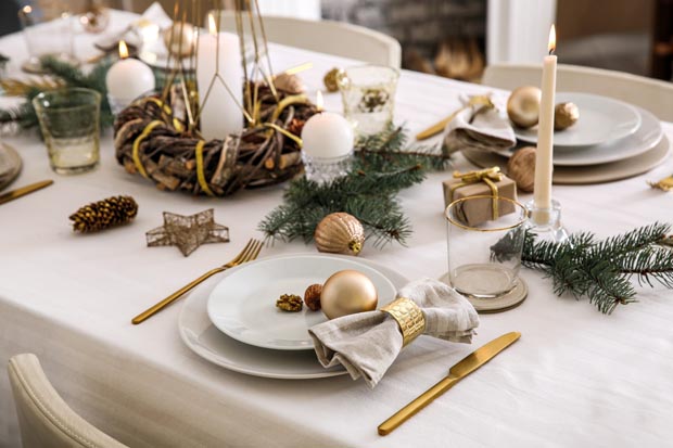 Beautiful table setting with Christmas decorations in living roo