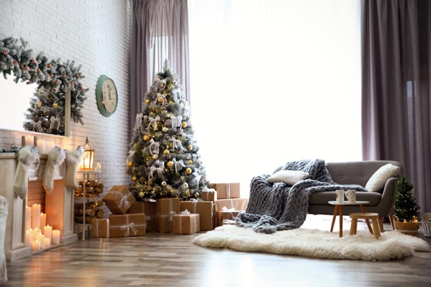 Stylish interior of living room with decorated Christmas tree