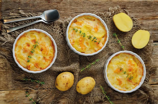 Pumpkin potato gratin with fresh thyme leaves