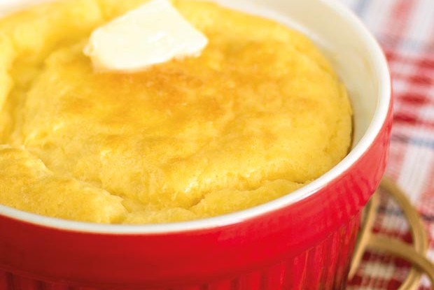 cheese souffle on a red and white cloth in a red bowl