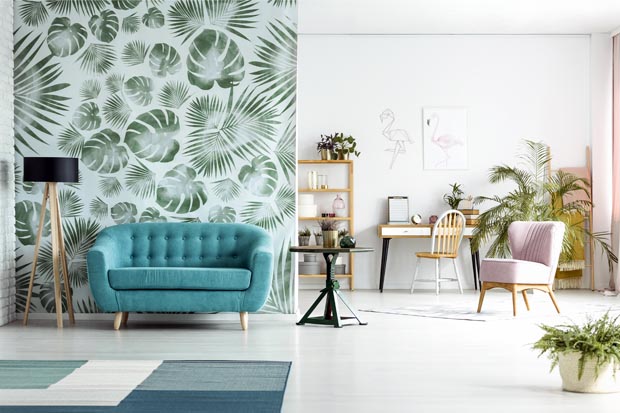 Spacious room with blue couch