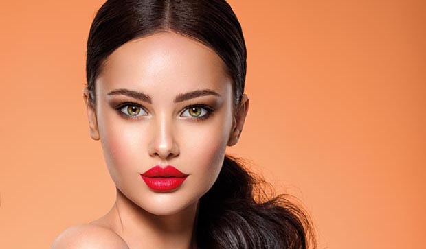 Beautiful white girl with a red lipstick on lips. Stunning brune