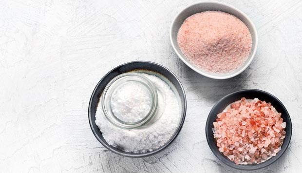 Different salt  types on grey background.