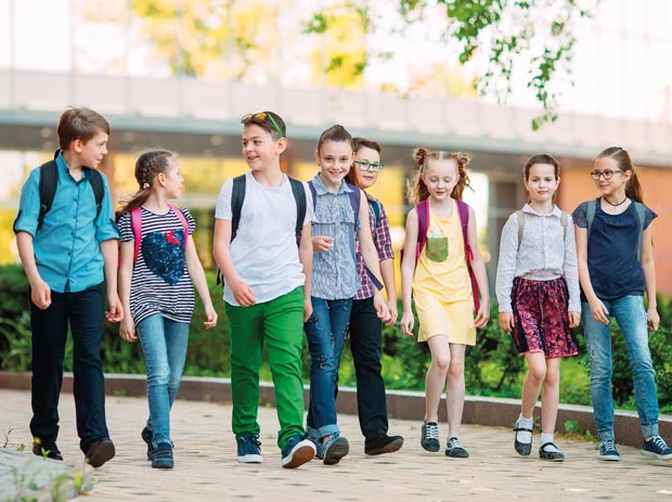 Group of kids going to school together.